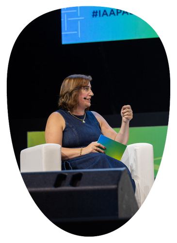 Laura Baxter speaking on stage at IAAPA Expo Europe 2026